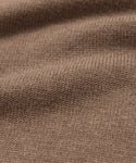Close-up of the Simone V-Necks brown knitted cotton merino fabric, featuring a visible ribbed texture and gentle folds—showcasing its soft, cozy feel thats perfect for a luxurious layer.