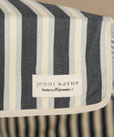 Striped fabric with a Jenni Kayne label on a blurred background