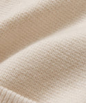Close-up of the Cooper Cardigans soft Warm Ivory fabric with a textured knit and gentle folds—ideal for bringing comfort and style to its structured silhouette.