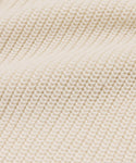 Close-up of cream-colored, ribbed knit with a textured, wavy surface—ideal for the Cotton Hayes Crewneck Cardigan, perfect as a lightweight summer layer or cozy cotton sweater.