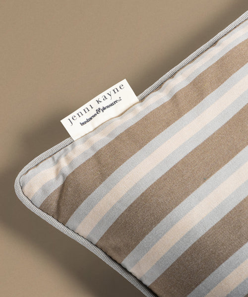 Striped fabric with a Jenni Kayne label on a beige background