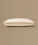 Beige pillow with a tag on a beige background