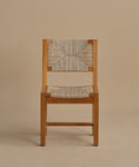 The Outdoor Montecito Dining Chair Frame features a simple, minimalist design with straight lines and an ECOLENE woven seat and backrest, crafted in teak wood and shown against a plain beige background.