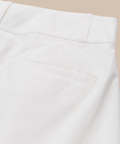 Close-up of the back of the Newport Short in white Italian cotton poplin, showing waistband with belt loops, a seam, and a single back pocket against a light beige background.