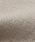 Close-up of the Fabric Swatch Performance Ivory showcases its textured weave and detailed fibers—an ideal choice for enhancing outdoor furniture pieces.