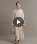 Thumbnail for video: Model wearing Cashmere Kate V-Neck and Pleated Skirt.
