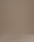 Thumbnail for video: A woman is shown wearing a long black pleated skirt, standing against a solid tan studio background.