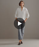 Thumbnail for video: Model walking in-studio wearing Cashmere Half-Zip in Ivory.