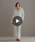 Thumbnail for video: Model walking in-studio wearing Cashmere Phoebe Polo.