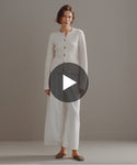 Thumbnail for video: Model walking in-studio wearing Cooper Cardigan in Ivory.