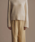 Thumbnail for video: Model wearing Cropped Jet in Pale Yellow.