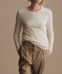 Thumbnail for video: Model wearing Long Sleeve Slim Tee in Warm Ivory.