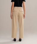 Someone stands facing away from the camera against a neutral background, wearing a black short-sleeve shirt, black shoes, and the Ranger Trouser—classic lightweight twill trousers with large back pockets.