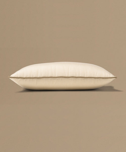 Beige pillow on a beige background