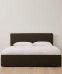 The Pacific Bed features a white Belgian Libeco linen bedding set and an upholstered headboard.
