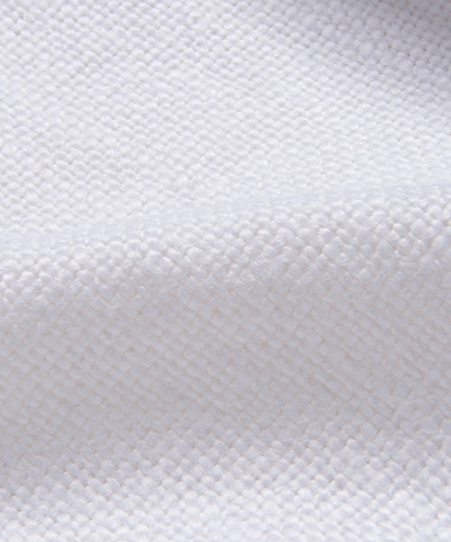 Close-up of the Miramar Chaise Slipcovers white linen fabric, featuring a soft, grid-like woven texture with gentle folds and raised weave—ideal for adding luxury to your chaise.